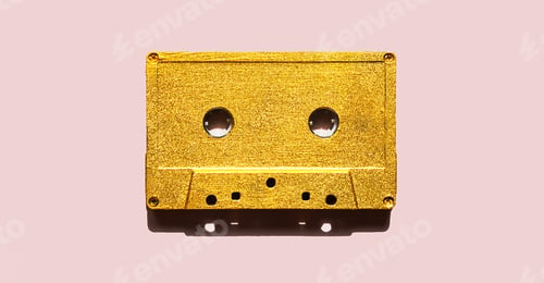 Preview: Retro Audio Cassette on Pink. Old Golden Colour Cassette Tape.
