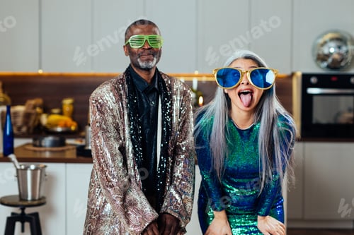 Preview: image of a multiethnic senior couple making party