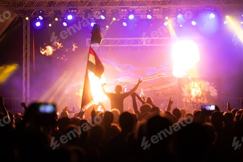 Preview: Crowd at concert and blurred stage lights.