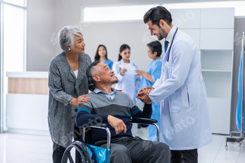 Preview: Mature doctor walking through the hallway to visit patient in hospital.