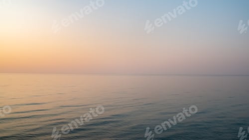 Preview: Stunning twilight view with a reflection on a calm seawater