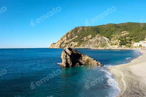 Preview: Explore the serene beaches and rocky coastlines of Cinque Terre, Italy during a sunny day