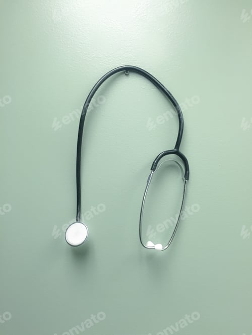 Preview: Doctors stethoscope hanging on the wall of a doctors office or nurses station for health or sickness