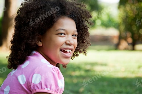 Preview: Young girl wearing pink spotty top, portrait