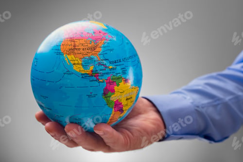 Preview: Businessman holding the world in his hands