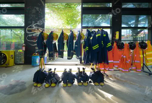 Preview: Firefighter Gear Hanging in a Station Indoors