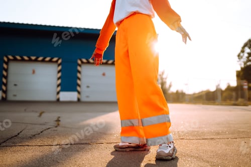 Preview: Young African American woman - dancer dancing in the street at sunset. Stylish woman with curly hair