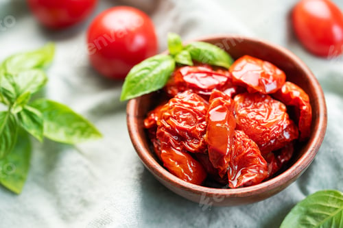 Preview: Bowl with sun dried tomatoes with fresh herbs and spices.