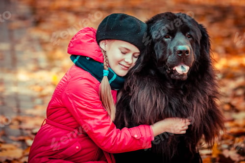 Preview: girl with a big dog. Love of a girl and a dog. Tibetan Mastiff and girl. Girl with a big dog in the