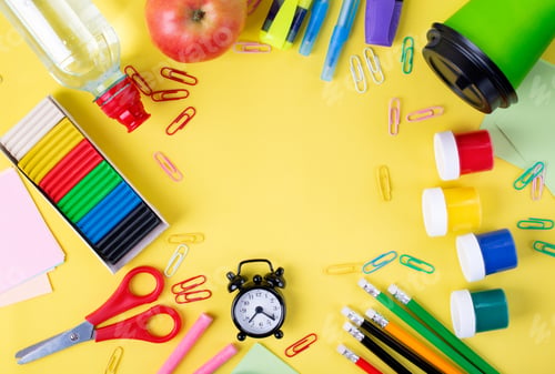 Preview: Back to school flat lay on yellow. Multicolored composition with school supplies