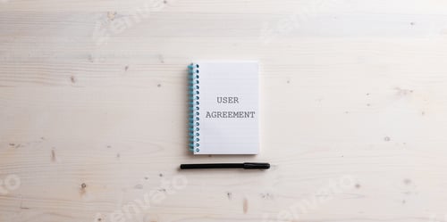 Preview: Spiral notebook with a User agreement sign written in it