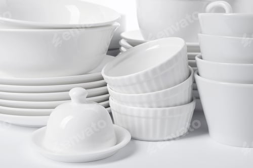 Preview: Set of clean tableware on white background, closeup. Washing dishes
