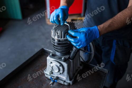 Preview: Mechanic fixing a compressor engine