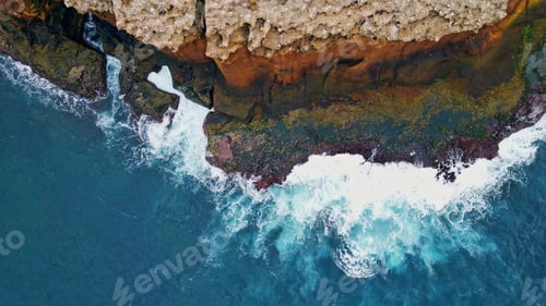 Preview: Powerful waves splashing cliffs coastline. Aerial stormy ocean hitting rocky
