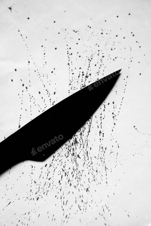 Preview: Vertical grey scale shot of a black knife with drops of blood splashed on a white surface