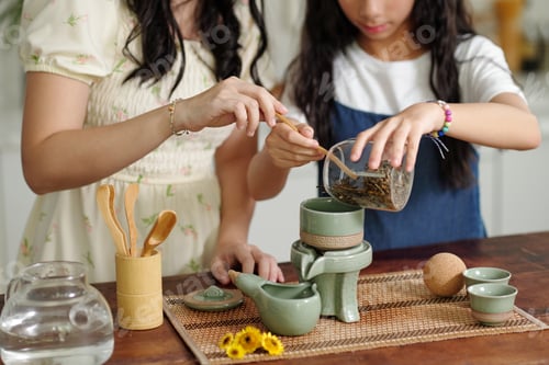 Preview: Mom Brewing Tea Together With Her Daughter
