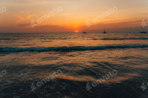 Preview: Orange beach at summer dusk on the island