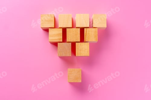 Preview: Top view of toy wooden blocks on pink