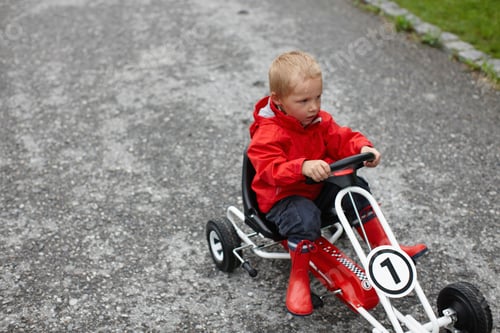 Preview: Toddler boy riding go-cart
