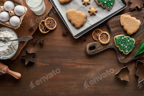 Preview: top view of Christmas cookies preparation on wooden table