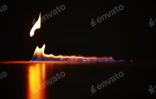 Preview: Studio shot of a small flame burning against a black background