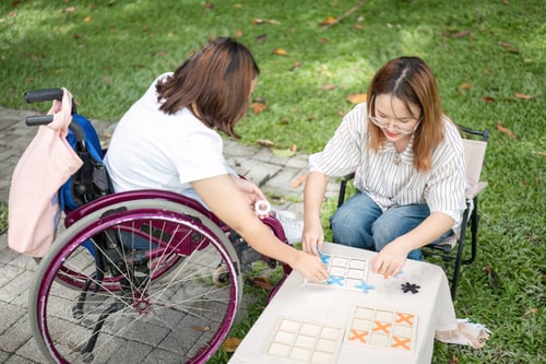 Preview: Young Disabled Woman and Best Friend Enjoying Outdoor Activities Together in a Park Setting