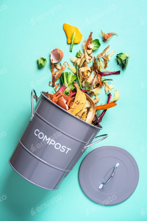 Preview: Trash bin for composting with leftover from kitchen on blue background. Top view. Recycling scarps