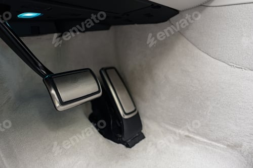 Preview: Brake and gas pedals of a luxury car