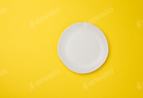 Preview: Empty white plate on white yellow background, top view