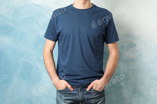 Preview: Men in blank blue t-shirt against color background, space for text
