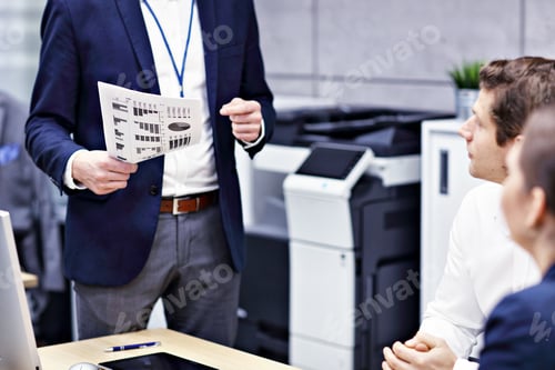 Preview: Midsection of business people brainstorming their ideas