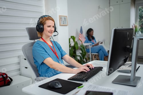 Preview: Female nurse working on computer providing telemedicine consultation