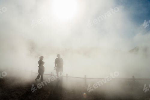 Preview: Two people in rising mist at a thermal pool site