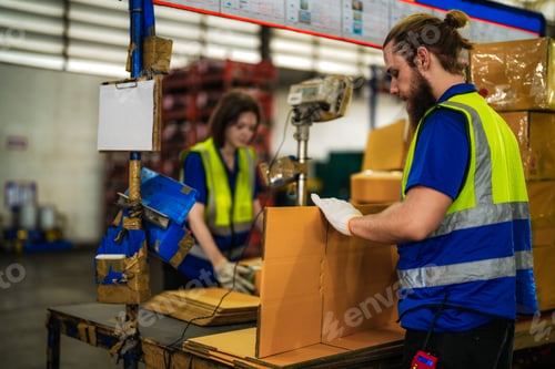 Preview: woman worker carpenter checking the quality of wooden products a