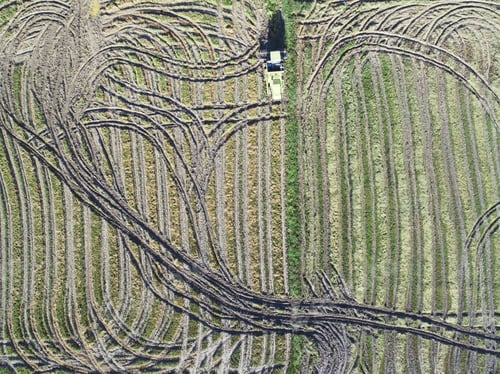 Preview: Aerial view of tractor in a farmland