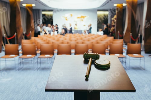 Preview: Hammer for the auction, on the background of the conference hall