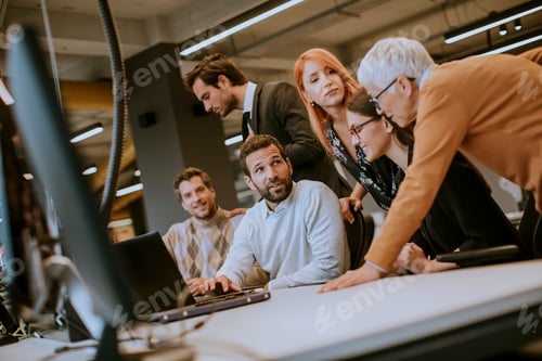Preview: business people with young adults and senior woman colleague