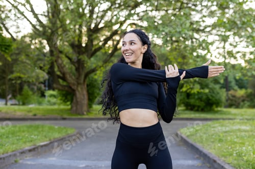 Preview: Active woman stretching arms before fitness in the park