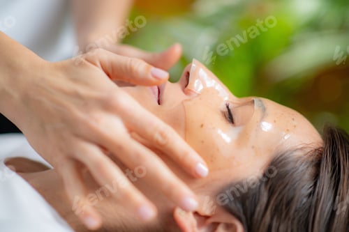 Preview: Woman indulges in a luxurious skincare treatment with a face mask at the beauty salon