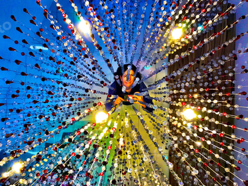Preview: woman looking up into an overhead of energy pattern and abstract lights and vectors