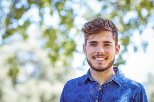 Preview: Handsome hipster looking at camera on a sunny day