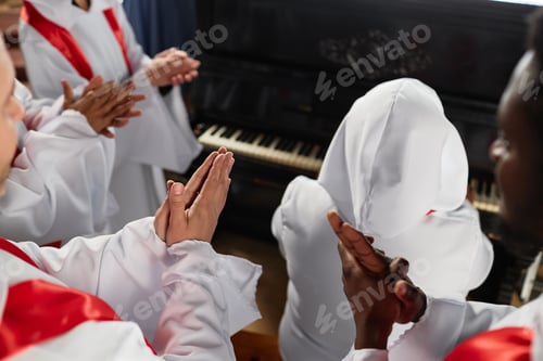 Preview: People from church choir singing in church