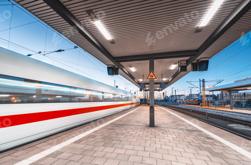 Preview: High speed train in motion on the railway station at night