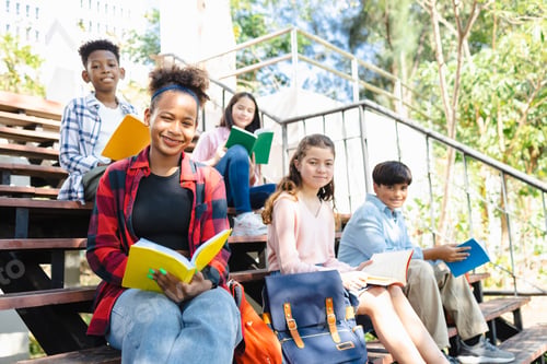 Preview: Group of diverse young attractive smiling students outdoors on campus at the school.