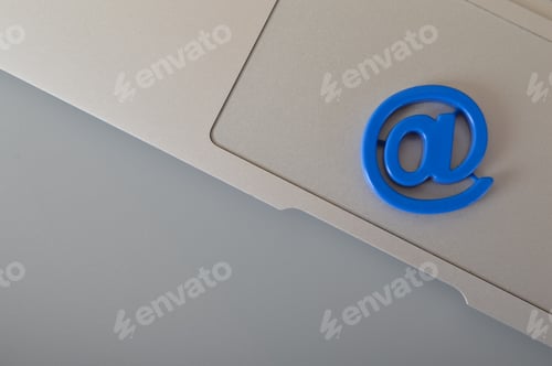 Preview: Grey laptop and email marketing symbol. Email marketing and internet email communication concept