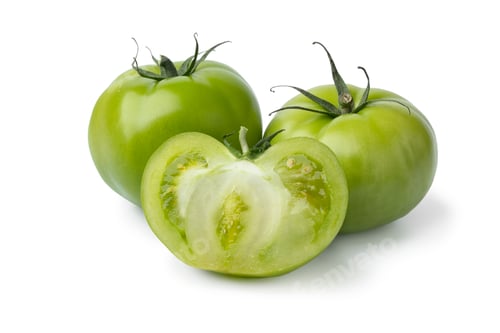 Preview: Whole and halved green unripe tomatoes