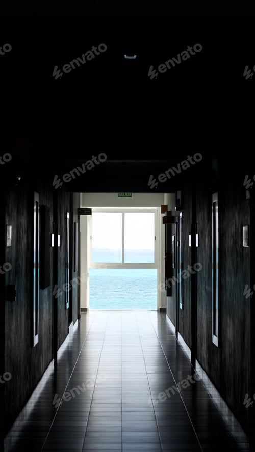 Preview: Dark hallway with tiles leading to ocean view, light illuminating the way