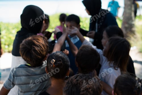 Preview: Bajau Laut children in Semporna, Sabah waiting for food distribution by volunteers