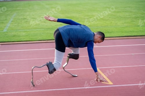 Preview: Asian para-athletes with prosthetic blades sprint on a running track at stadium.