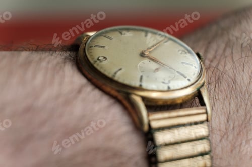 Preview: Close-up view of old wristwatch around wrist.